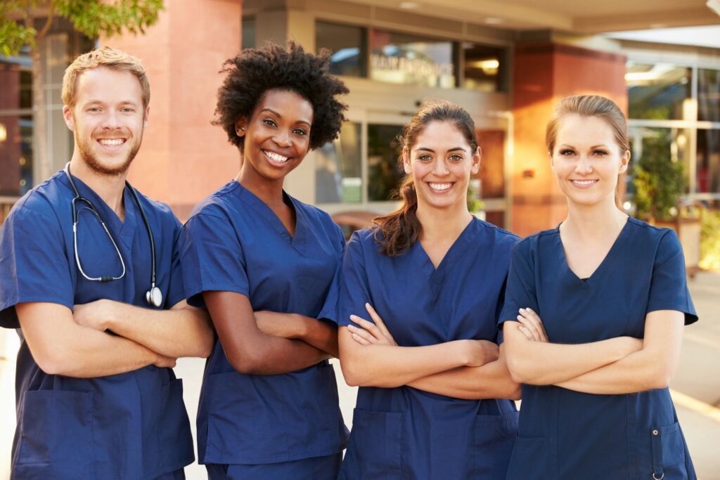 Nursing students standing in front of hospitable resource center.