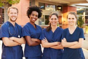 Nursing students standing in front of hospitable resource center.