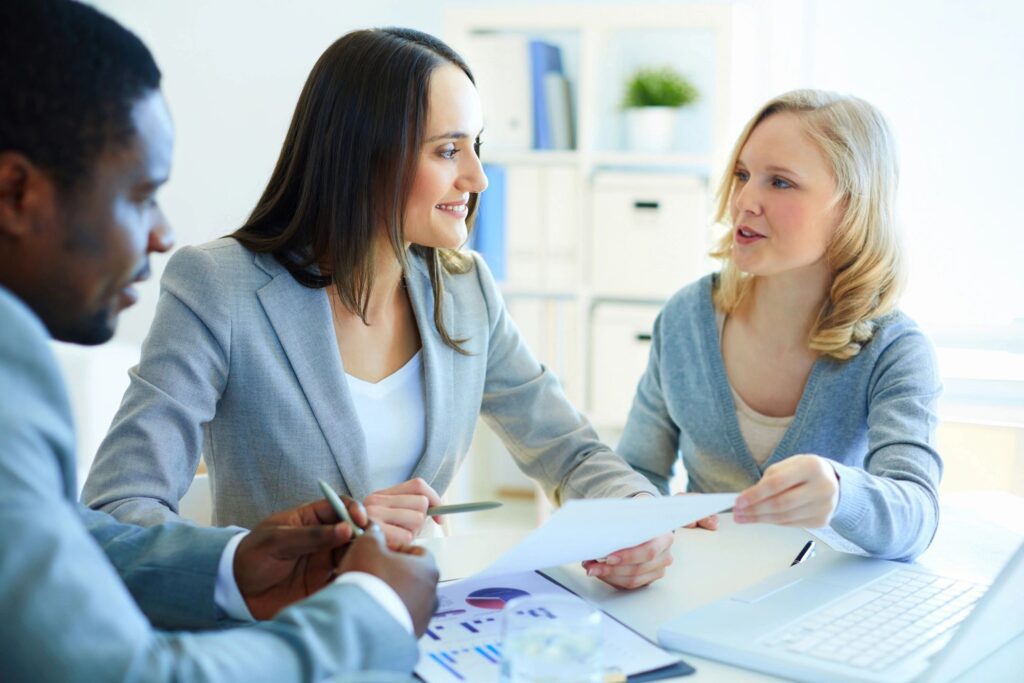 Nursing student discussing different option with financial advisor.